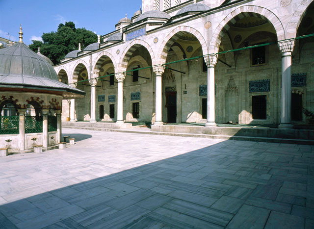 Courtyard view with mosque portico and ablution fountain