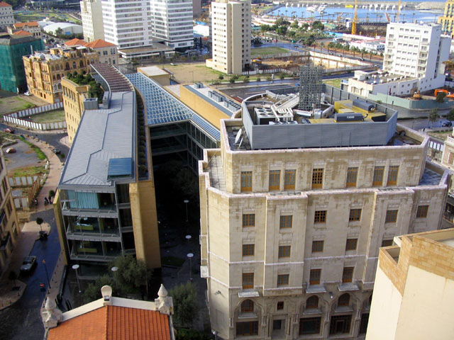 Bank Audi Headquarters - Bank headquarters, as seen from the clocktower of St. Louis Church; the church's red tiled roof and a preserved stone building are seen in the foreground