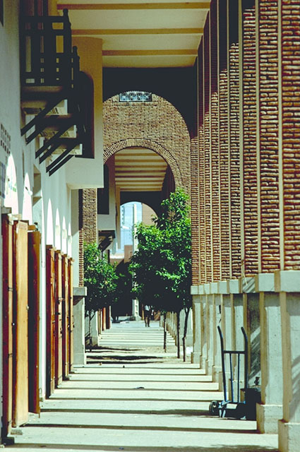 View along the perimeter arcade which connects the three apartment blocks