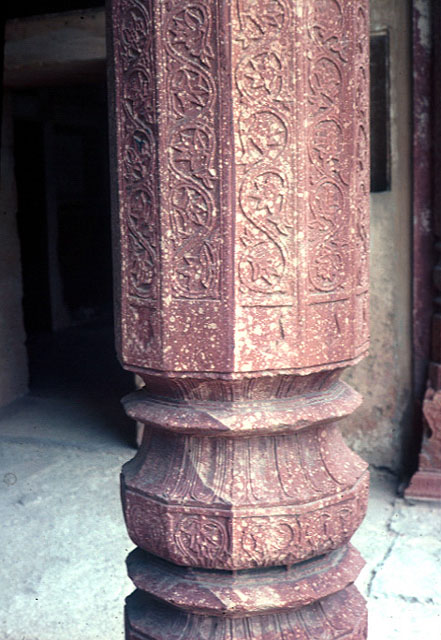 Exterior detail of column base, showing carving and patterns