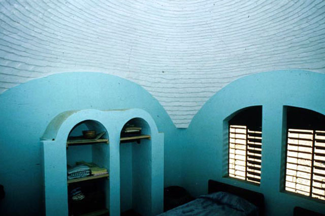 Interior view of room, showing built in storage spaces and domed ceiling
