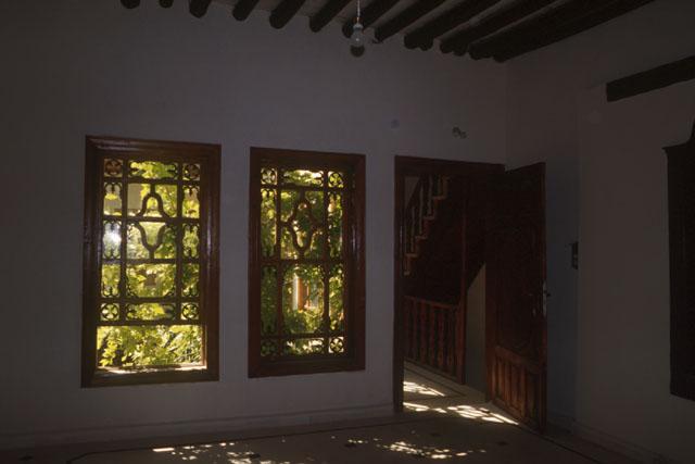 Interior view showing use of wooden beams, window frames and door
