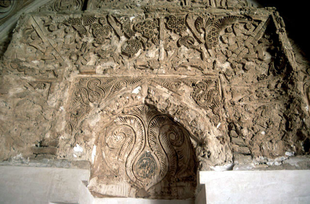Detail view of the carved stucco arch above the corner mihrab
