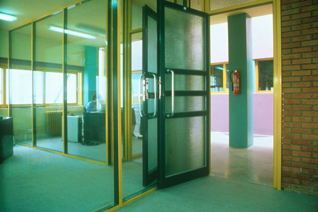 View through glass room partitions and frosted doors