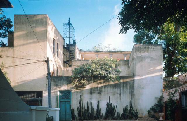 Exterior view of façade showing caged exterior staircase