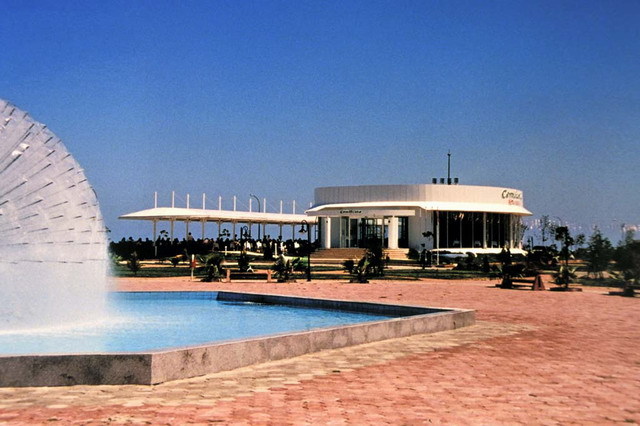 Exterior view, with sculpture in ornamental pool