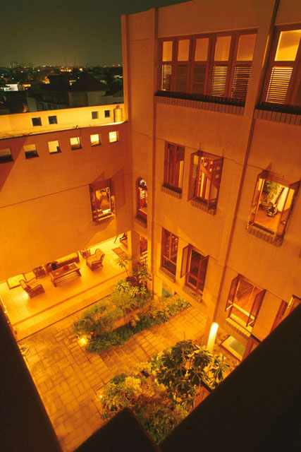 Omar House - Aerial view showing four stories and roof terrace that encompass open courtyard