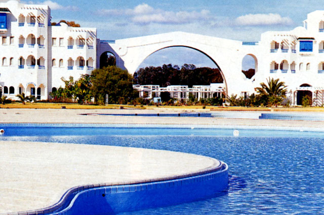 Exterior view of poolside before dramatic archway