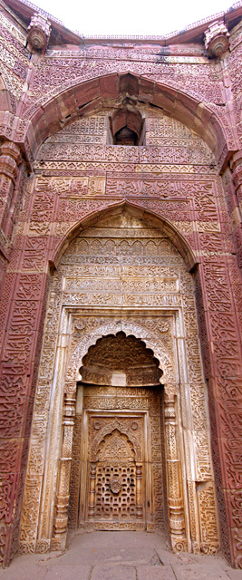 Shams al-Din Iltutmish Tomb - Detail view of the carvings done on the higher walls of the tomb, done in different bands of motifs and Kufic inscriptions
