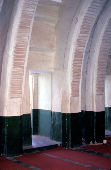 Two sets of embedded piers surrounding a doorway in the north wall.  Note the decorated soffits on the twin bakuna.