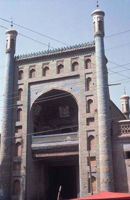 Main gateway of mosque with engaged minaret-like columns and recessed niches