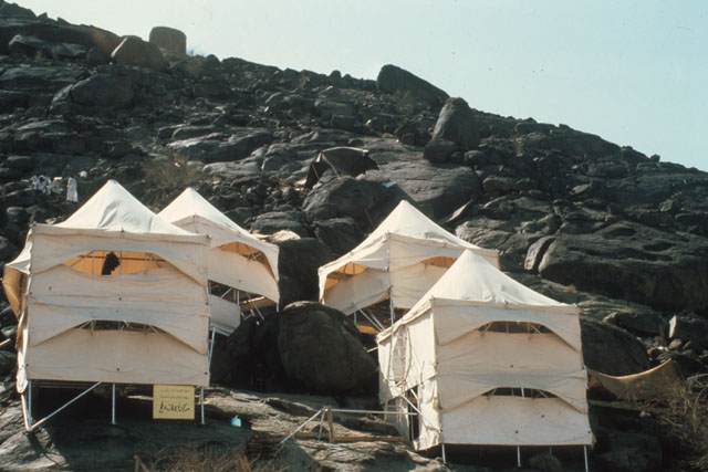 Exterior view showing tented shelters in mountains