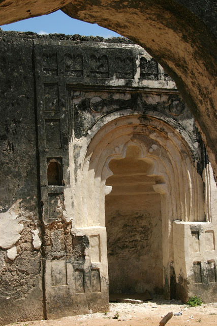 View of old congregational mosque showing carved coral boss of mihrab wall