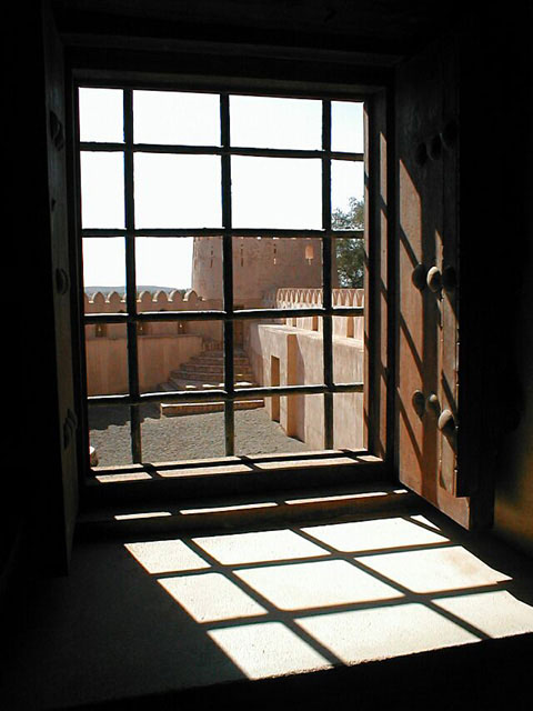 Rectangular window with iron grill at the roof level