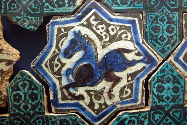 Horse on eight-pointed star tile, surrounded with cruciform tiles in turquoise and black (Karatay Museum, Konya)