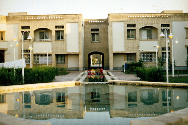 Exterior view showing reflection pool before façade