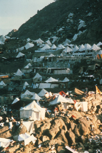 Exterior view showing tented shelters in mountains