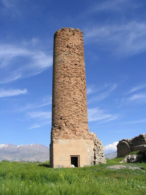View of minaret from west, with door on cut stone base