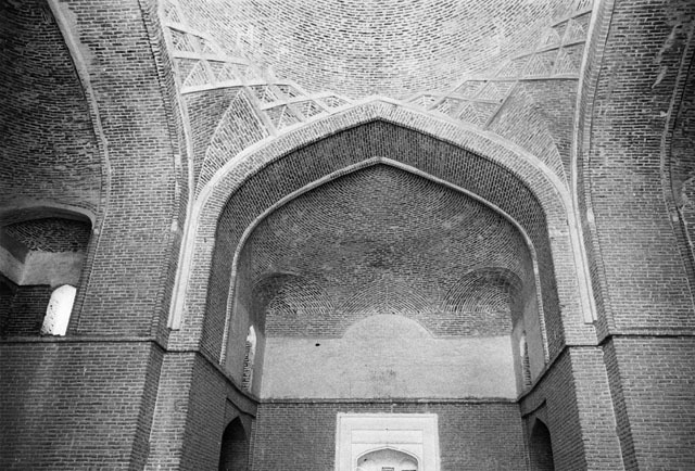 Interior view of sanctuary, looking up at mihrab semi-vault and zone of transition to dome