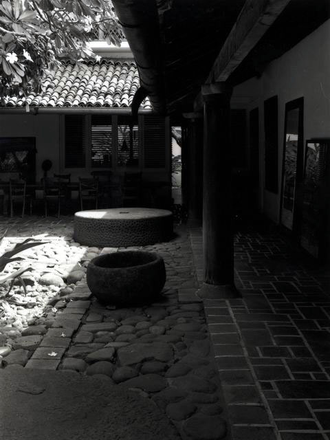 Osmund and Ena de Silva House - Exterior detail showing contrasting stone and brick patterned path under covered corridor