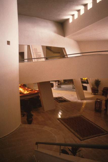 Interior view showing transition from paths and halls to open reception spaces