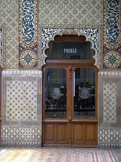 Interior view showing a cusped arch doorway and tilework surrounding it