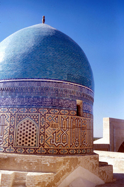 Exterior detail, showing calligraphy and tile work adoring the dome and its drum