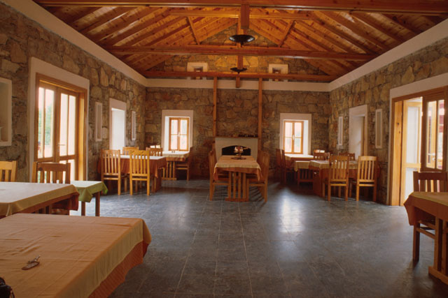 Interior view showing dinning room with stone and wood detailing