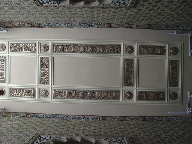 Interior view of ceiling showing tops of cusped doorways