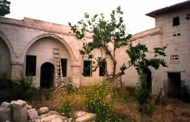Exterior view of House 2 in upper court, before restoration
