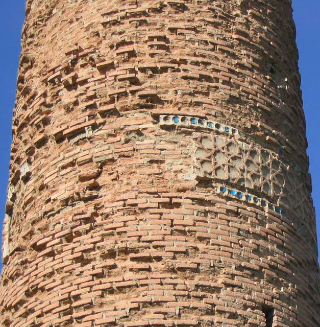 Detail of minaret showing decorative band with red and blue tiles, view from southwest