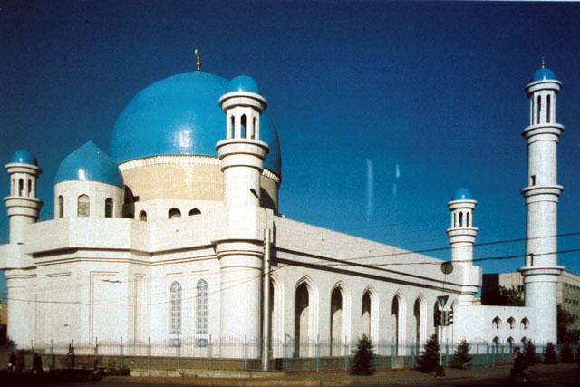 Exterior view showing stone façade with bulbous blue domes