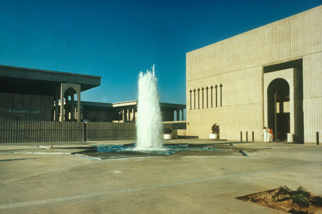 Exterior view of central fountain against façades