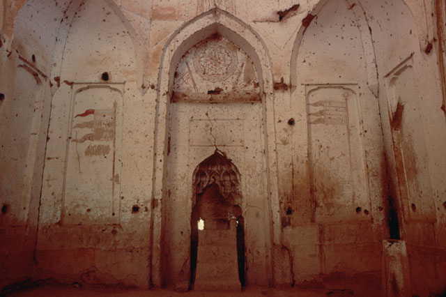 Interior view of dome chamber showing mihrab on qibla wall
