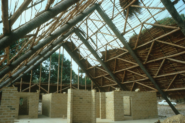 Interior view showing construction of wood frame with brick partitions
