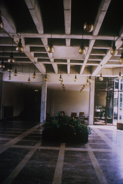 Interior view showing recessed patters in ceiling and dropped globe lights