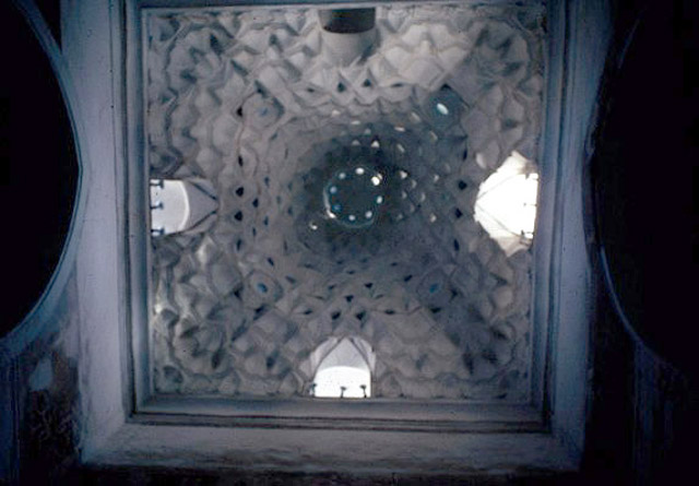 View looking up at the muqarnas mausoleum dome