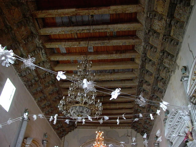 Interior view of carved wooden ceiling (artesonado) with rows of cornice brackets