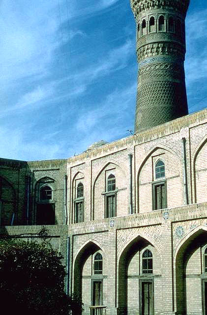 Amir Olimxon Madrasasi - View within the madrasa courtyard, facing southeast to the Kalyan minaret beyond