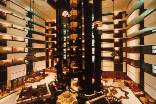 Interior view showing central atrium with fountain, elevator shaft and balconies