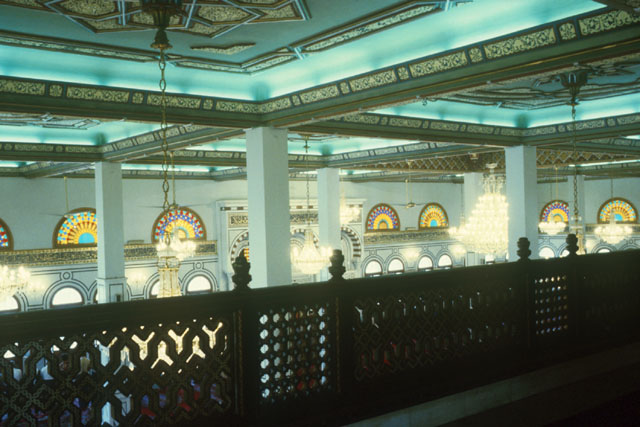 Interior view from gallery showing colored glass in clerestory windows
