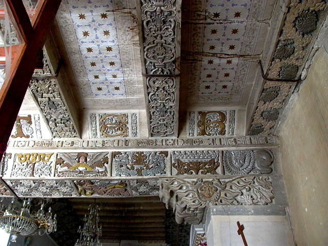 Interior detail view of partial capital and ceiling at corner