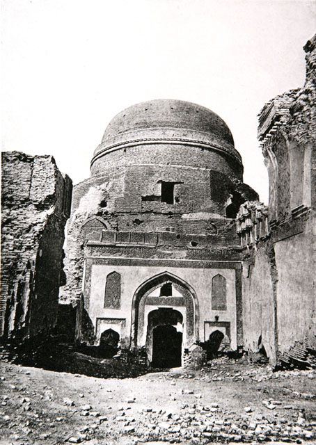 Exterior view looking towards tomb portal through ruined pishtaq