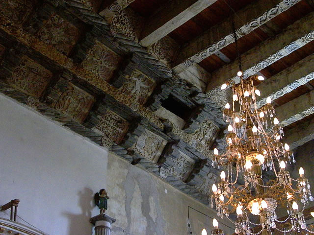 Detail interior view of carved wood ceiling (artesonado) joists and cornice members