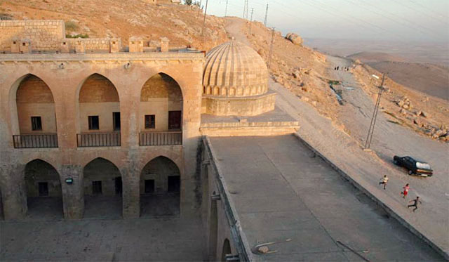Elevated view of madrasa courtyard, looking east across the flat roof of the northern wing