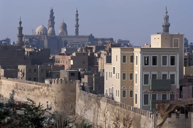 Elevated exterior view from northeast (al-Azhar Park), after restoration. The Sultan Hasan and Al-Rifa'i Mosques appear in the left background while the restored Ayyubid city wall is seen in the foreground