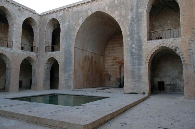 View of madrasa courtyard, looking southwest towards the grand iwan preceded by pool