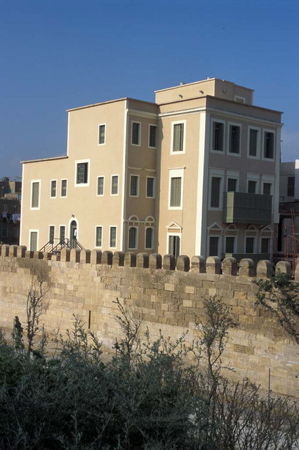 Exterior view from east-southeast, after restoration, with the restored Ayyubid city wall seen in the foreground