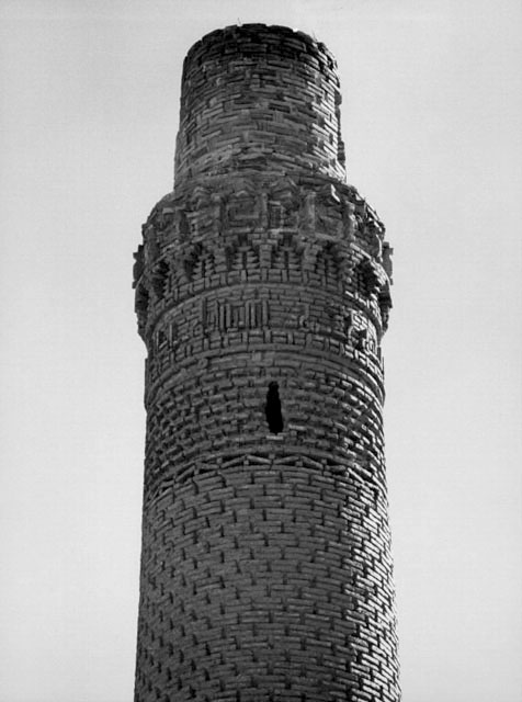 View of minaret showing top with Kufic frieze