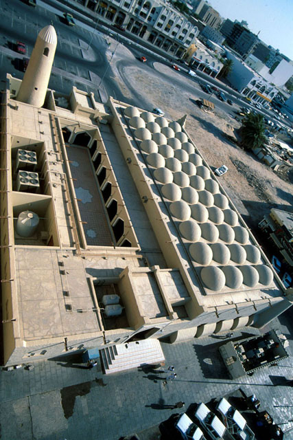 Aerial view showing dome covered prayer hall, courtyard, HVAC system and minaret
